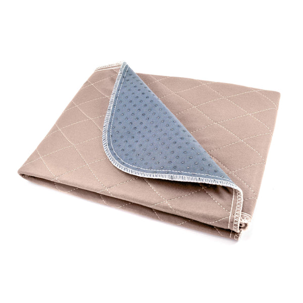 Load image into Gallery viewer, Folded Pipco Pets washable pee pad in light brown with one corner folded back showing non-slip dots on the back