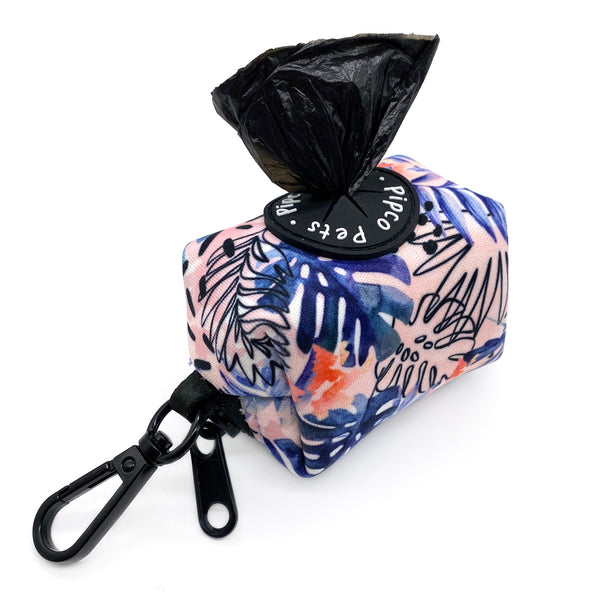 Load image into Gallery viewer, Pipco Pets dog poo bag dispenser with Tropic Fronds tropical leaves print pattern in blue and has poo bag poking out the top