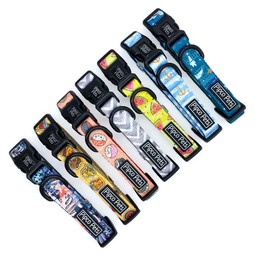 Seven Pipco Pets dog collars laid out in a row showing the available colour print designs