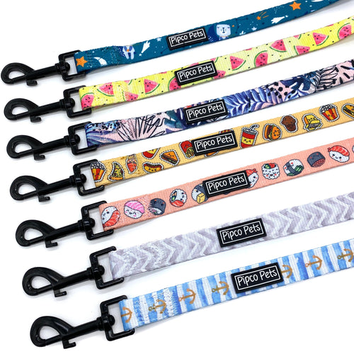 Seven Pipco Pets dog leashes laid out in a row showing the available colour print designs