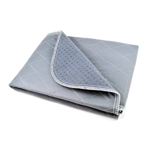Load image into Gallery viewer, Folded Pipco Pets washable pee pad in grey with one corner folded back showing non-slip dots on the back
